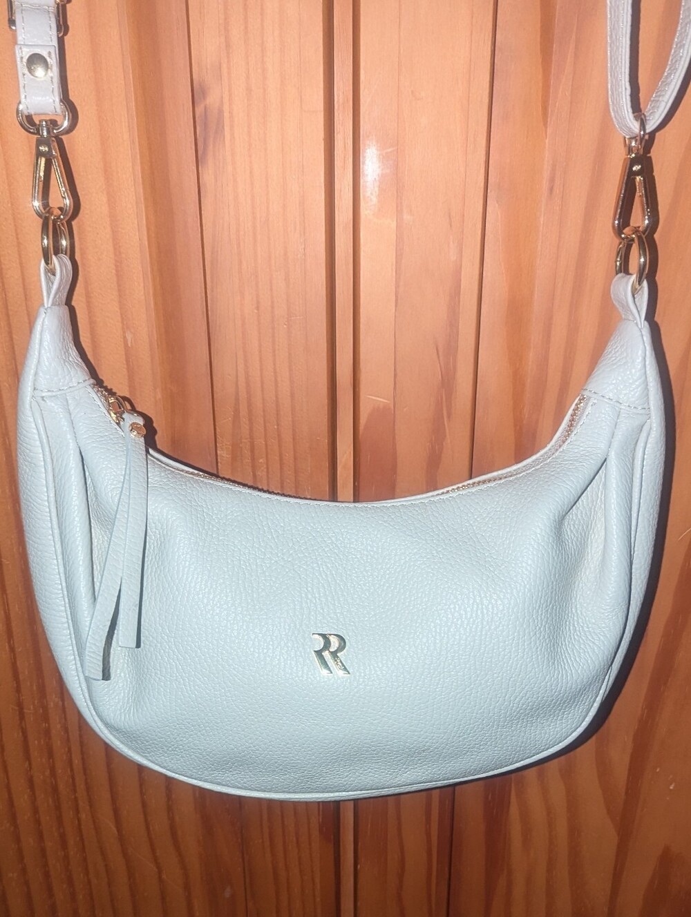 Rossi Aurora Pebbled Leather Crescent Crossbody Bag in Cream with Gold Hardware